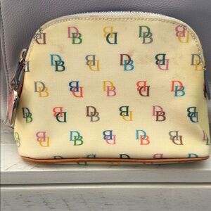 Dooney & Bourke Small Cream  Logo Cosmetic Bag Very Good Condition